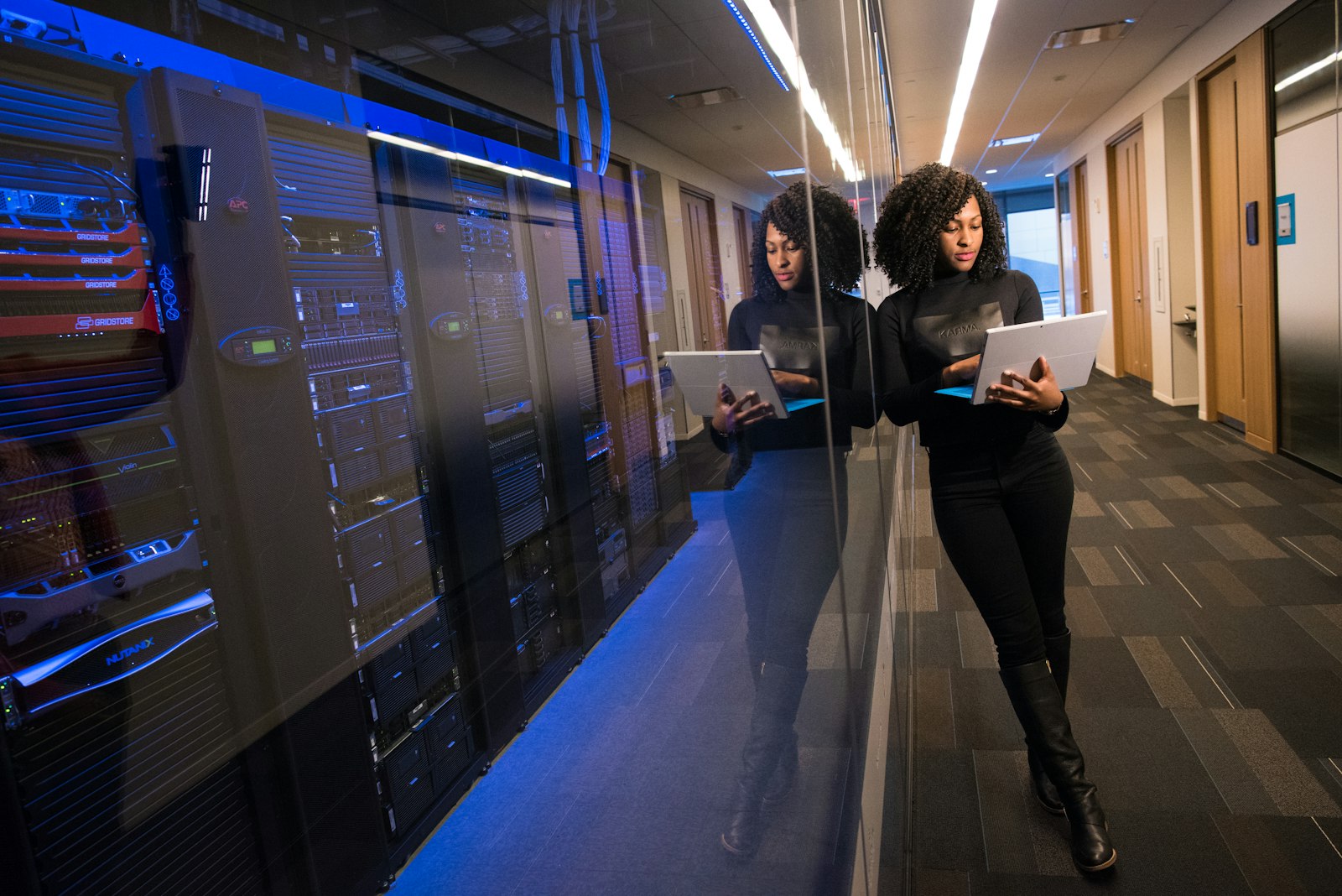 A technology professional reviewing systems in a data centre
